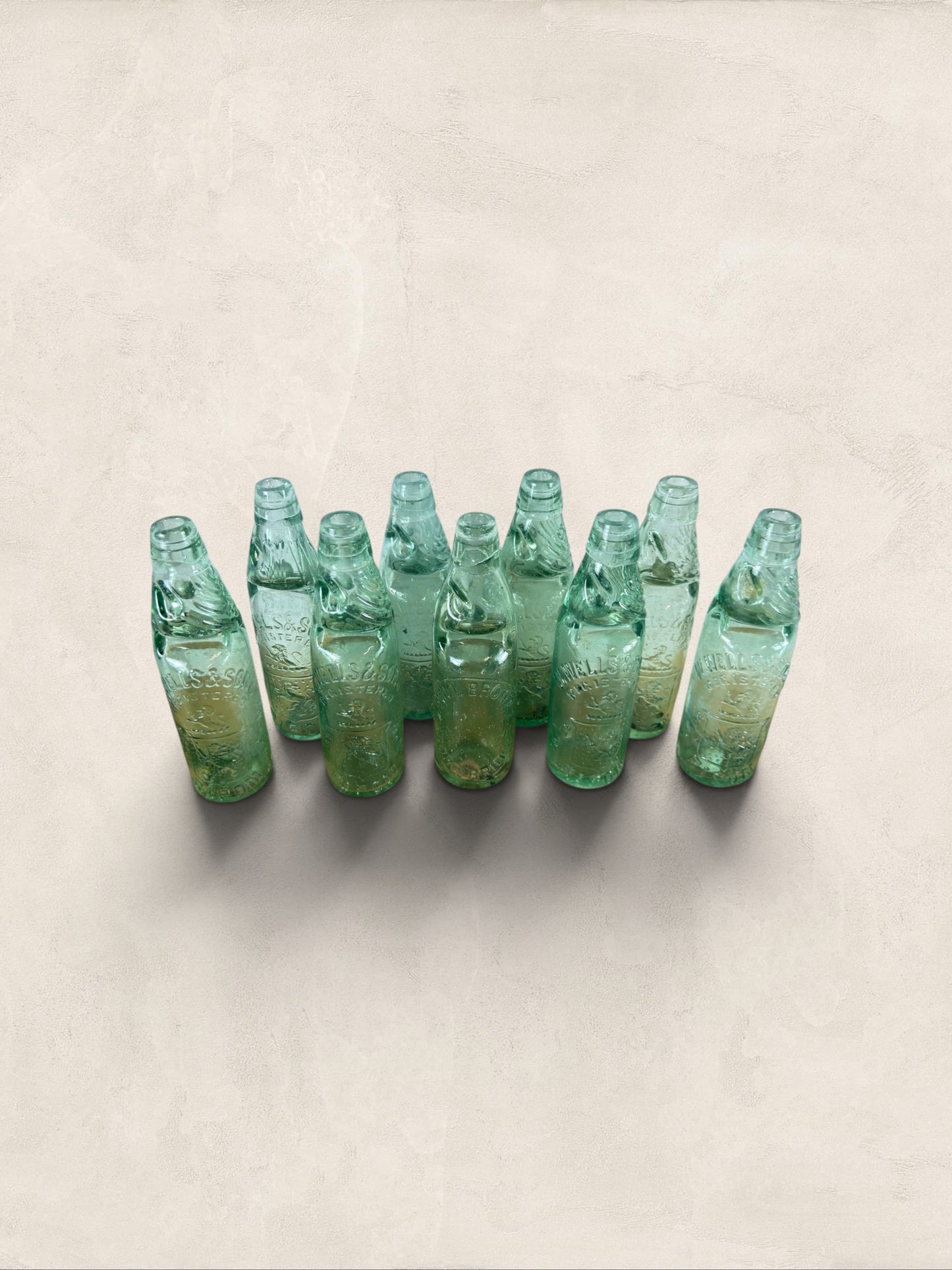 Collection of 9 English Antique Aqua Glass Cod Neck Marble Bottles, Bristol, Circa 1900
