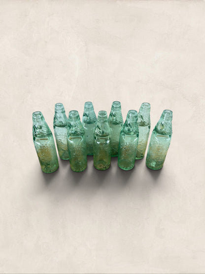 Collection of 9 English Antique Aqua Glass Cod Neck Marble Bottles, Bristol, Circa 1900