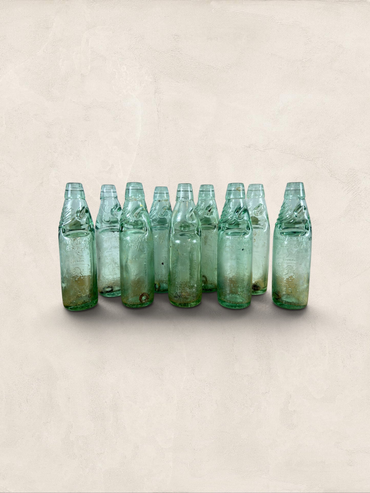 Collection of 9 English Antique Aqua Glass Cod Neck Marble Bottles, Bristol, Circa 1900