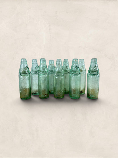 Collection of 9 English Antique Aqua Glass Cod Neck Marble Bottles, Bristol, Circa 1900