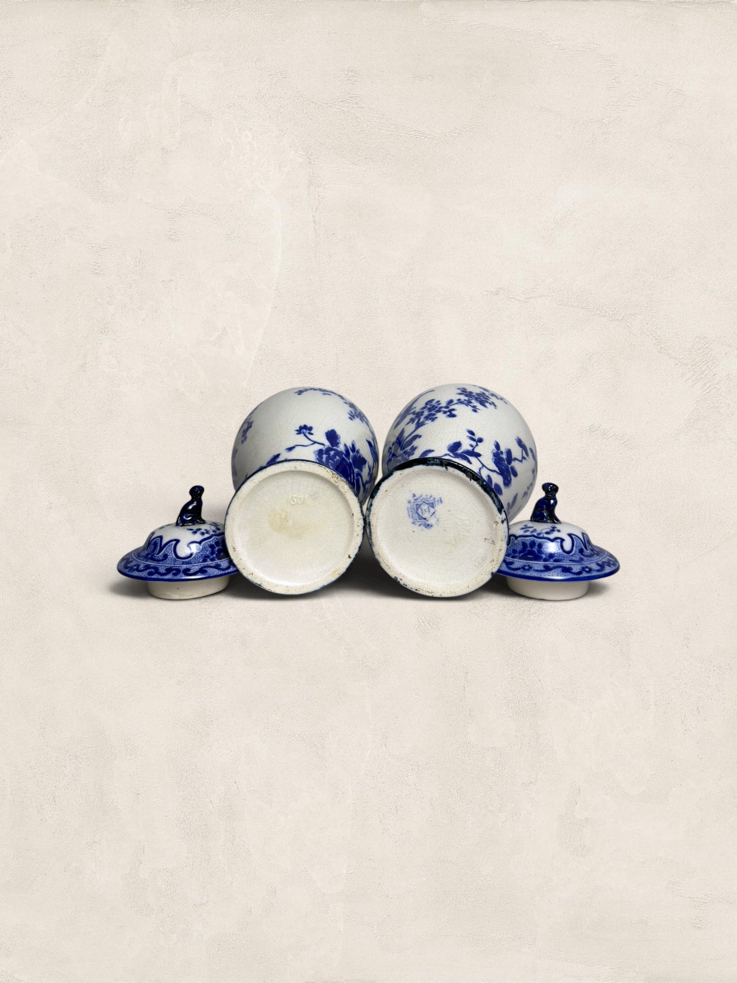 Pair of Blue & White Crackle Glazed Covered Urns with Bird Finials