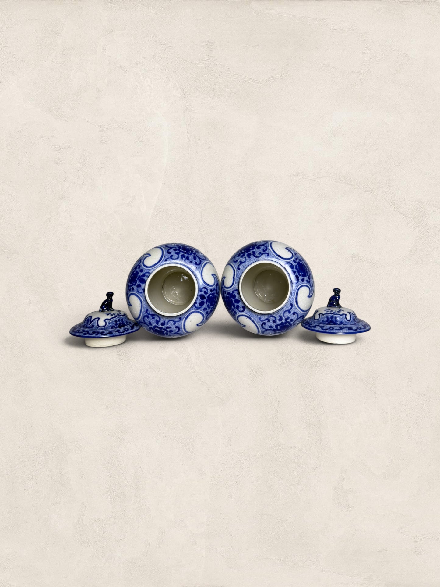 Pair of Blue & White Crackle Glazed Covered Urns with Bird Finials