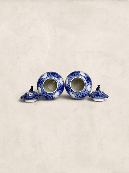Pair of Blue & White Crackle Glazed Covered Urns with Bird Finials