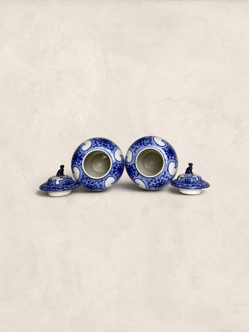 Pair of Blue & White Crackle Glazed Covered Urns with Bird Finials