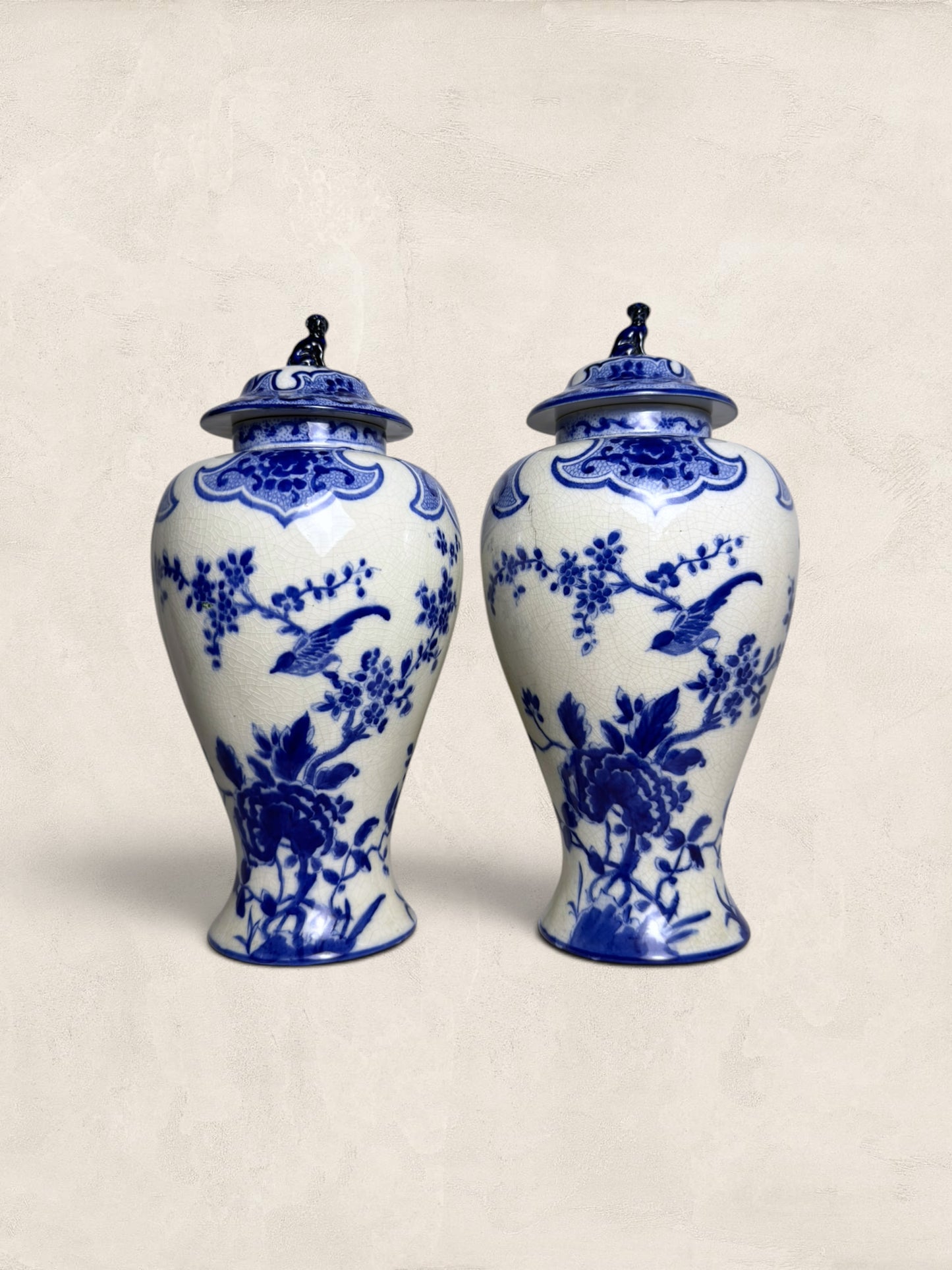 Pair of Blue & White Crackle Glazed Covered Urns with Bird Finials