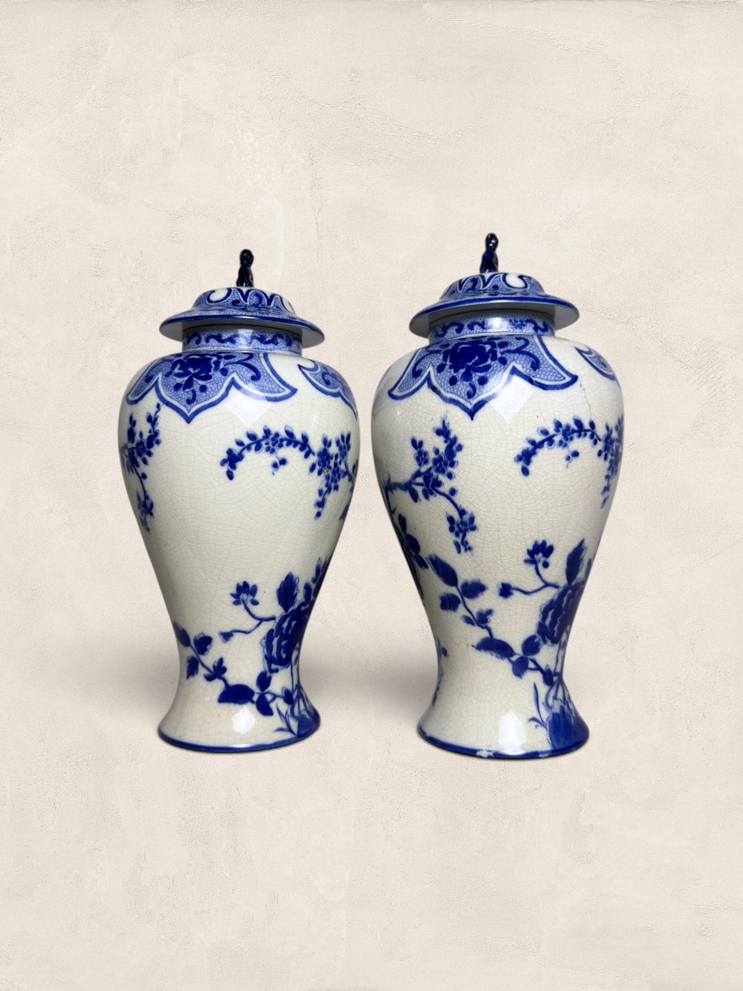 Pair of Blue & White Crackle Glazed Covered Urns with Bird Finials