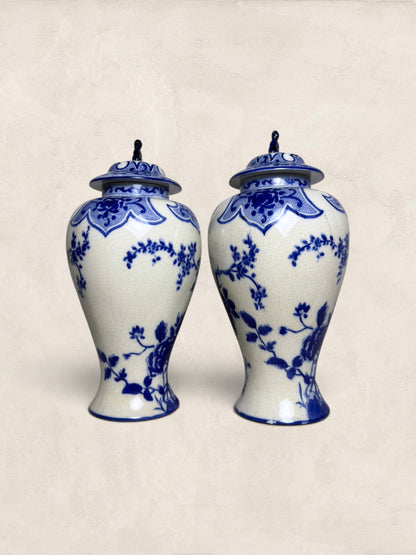 Pair of Blue & White Crackle Glazed Covered Urns with Bird Finials