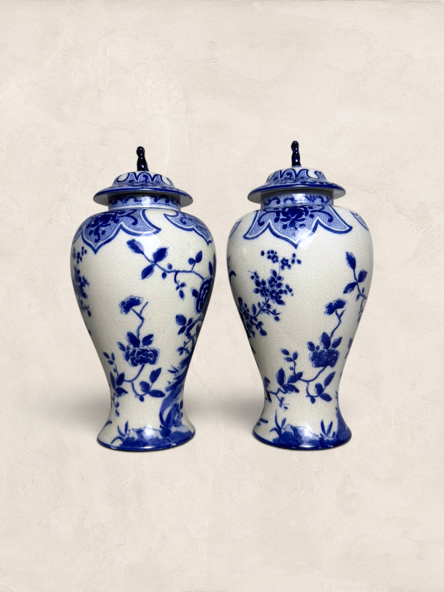 Pair of Blue & White Crackle Glazed Covered Urns with Bird Finials