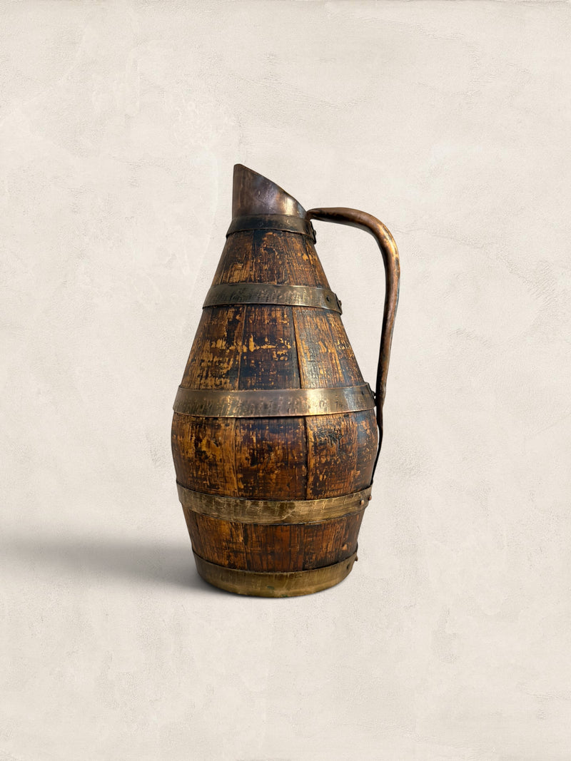 Antique French barrel-shaped cider/wine jug made of staved oak with copper banding and a forged metal handle. Decorative item.