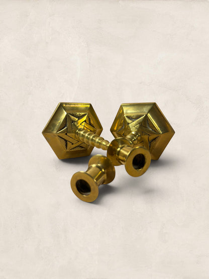 Stone and Relic pair of vintage brass hexagonal base candlesticks with aged patina and decorative etching.