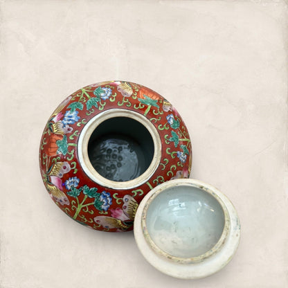 Stone and Relic decorative ceramic ginger jar with butterfly and floral motif in red, yellow, pink, green, and blue.