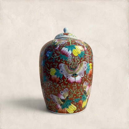 Stone and Relic decorative ceramic ginger jar with butterfly and floral motif in red, yellow, pink, green, and blue.