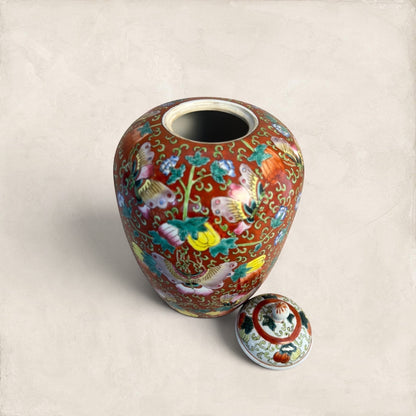 Stone and Relic decorative ceramic ginger jar with butterfly and floral motif in red, yellow, pink, green, and blue.